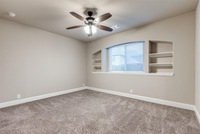 carpeted empty room with ceiling fan