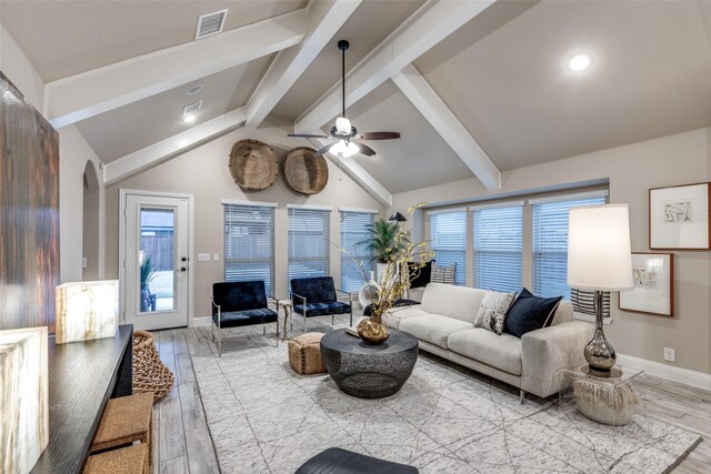 dining room with a notable chandelier, plenty of natural light, and light hardwood / wood-style flooring