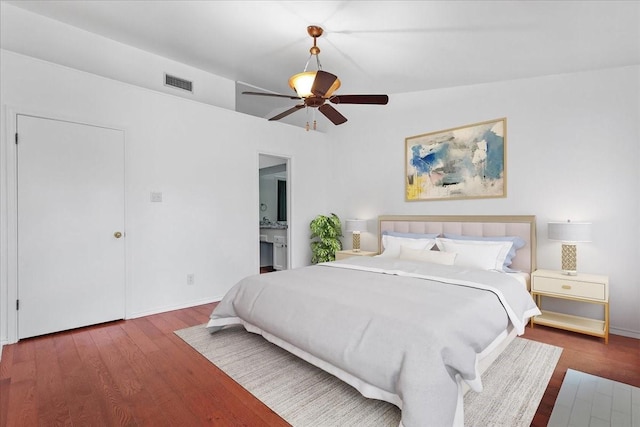 bedroom with vaulted ceiling, ceiling fan, and dark hardwood / wood-style floors