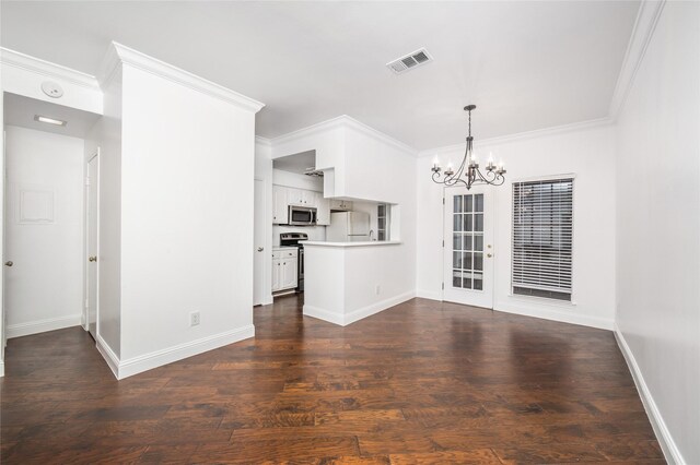 unfurnished living room with dark hardwood / wood-style floors, crown molding, and a notable chandelier