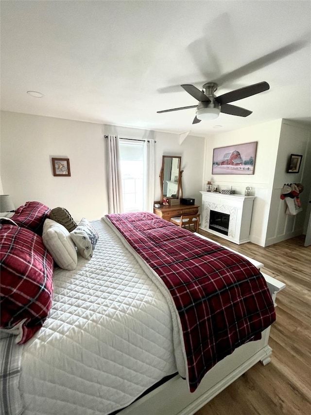 bedroom featuring hardwood / wood-style flooring and ceiling fan