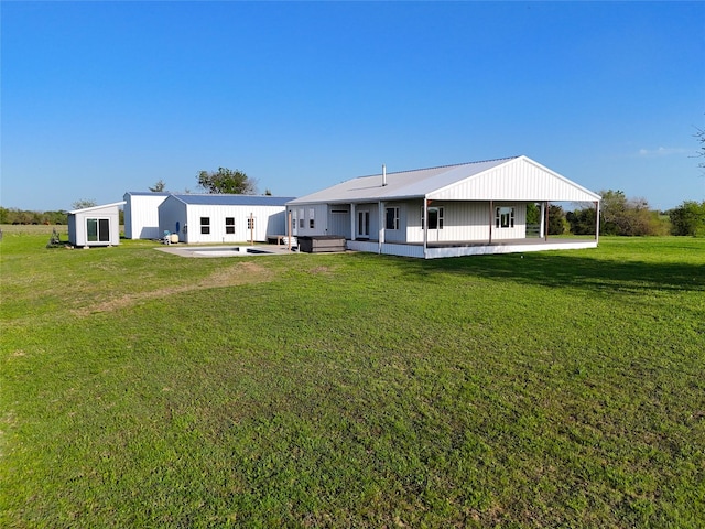 back of property with a yard