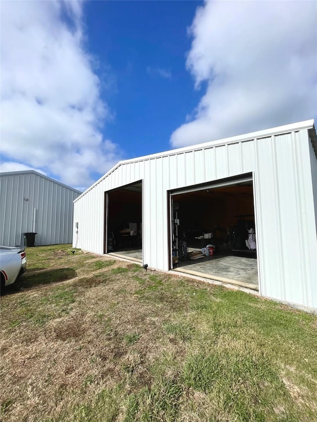 garage with a lawn