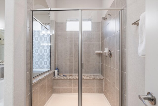 bathroom with an enclosed shower