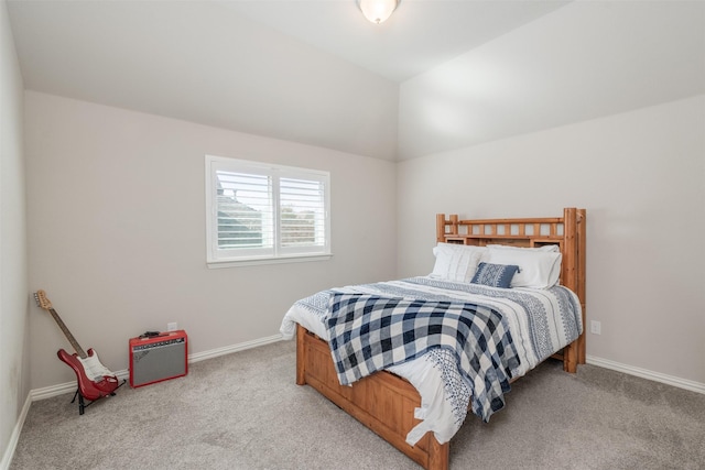 carpeted bedroom with vaulted ceiling