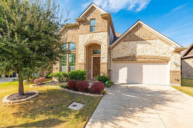 view of front of home featuring a garage and a front lawn