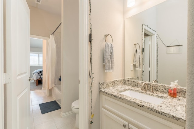 full bathroom with tile patterned floors, vanity, shower / tub combo, and toilet