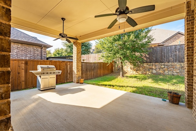 view of patio with ceiling fan and a grill