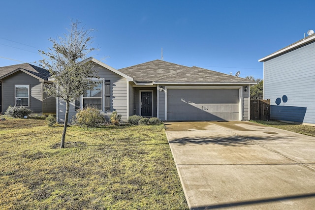 ranch-style house featuring a garage and a front yard