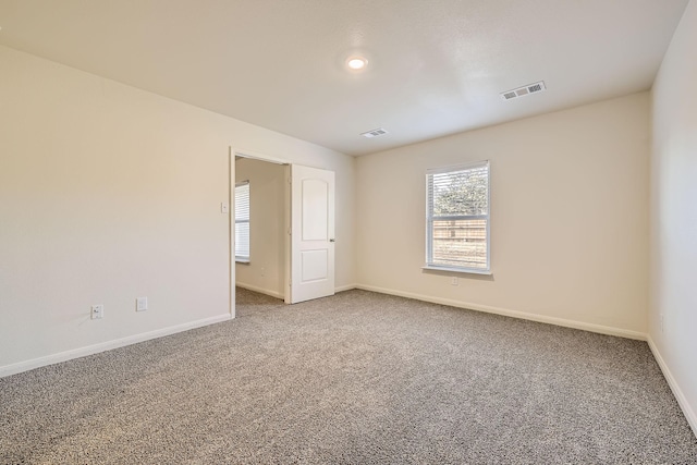 view of carpeted spare room