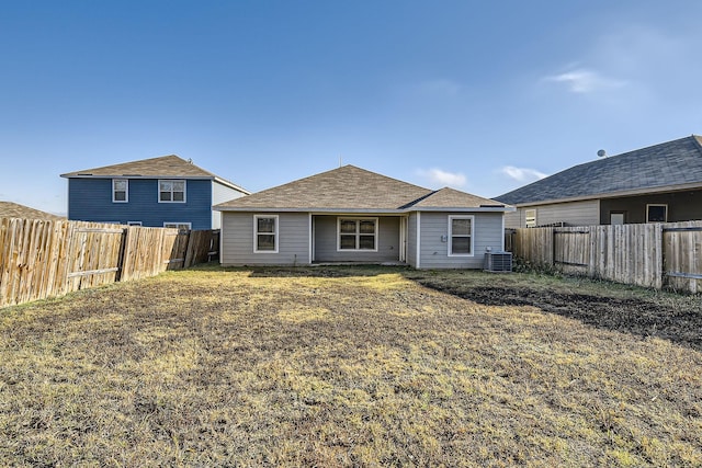 back of house featuring a yard