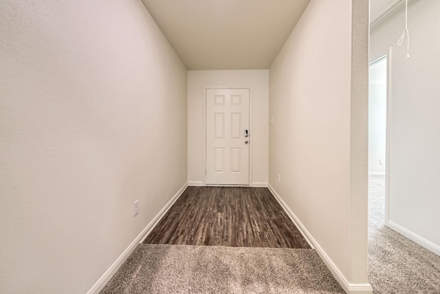 corridor featuring dark hardwood / wood-style flooring