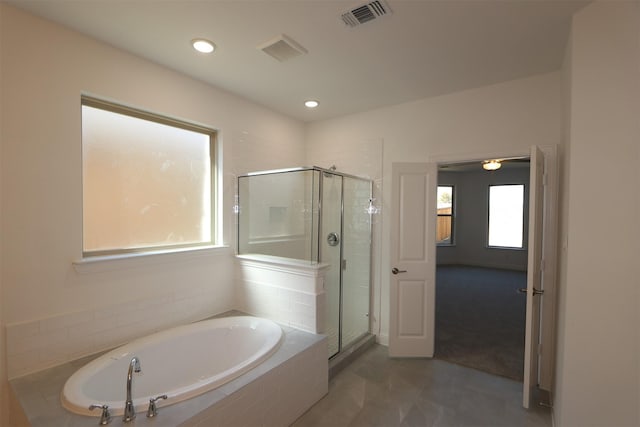 full bathroom featuring visible vents, a shower stall, and a bath