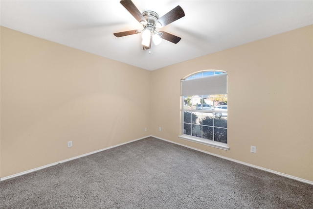 empty room featuring ceiling fan and carpet floors