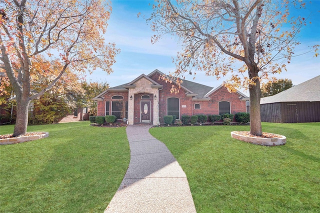 ranch-style home with a front yard