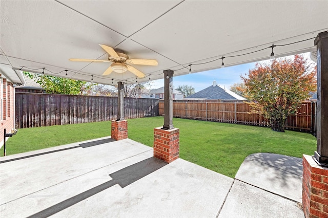 view of patio featuring ceiling fan