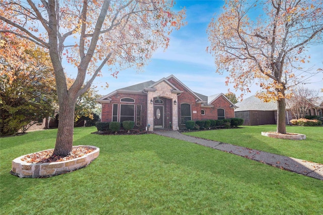 single story home with a front yard