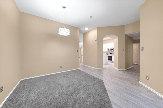 unfurnished room with light wood-type flooring