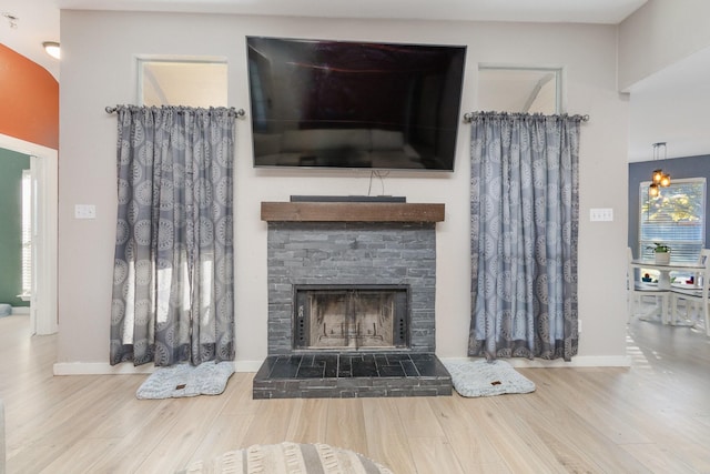 living room featuring a fireplace and hardwood / wood-style floors