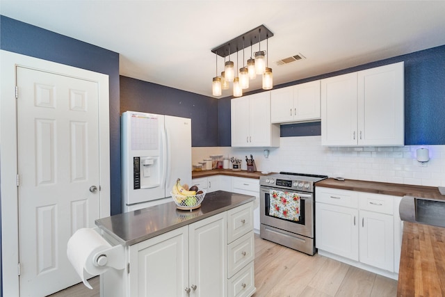 kitchen featuring stainless steel electric stove, white cabinets, light hardwood / wood-style floors, and white refrigerator with ice dispenser