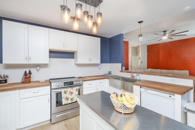 kitchen with wood counters, sink, electric range, dishwasher, and white cabinetry