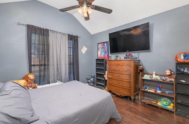 bedroom with vaulted ceiling, ceiling fan, and dark hardwood / wood-style floors