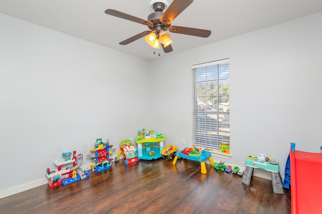 recreation room with dark hardwood / wood-style floors and ceiling fan