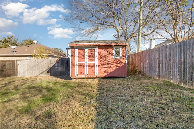 view of outbuilding with a lawn