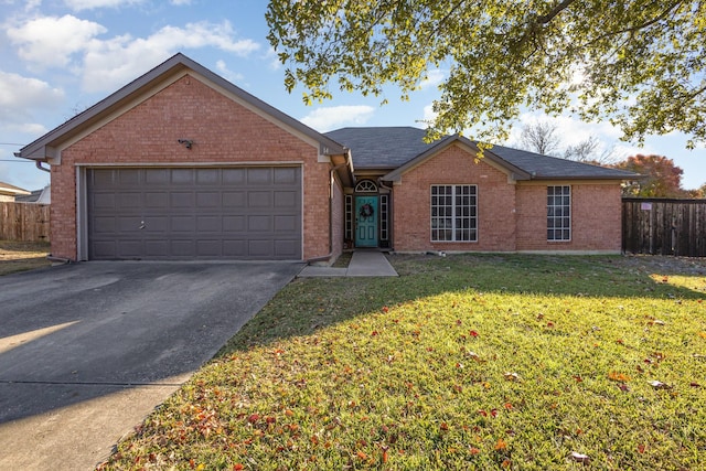 ranch-style house featuring a garage and a front yard