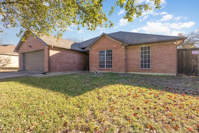 single story home with a garage and a front lawn