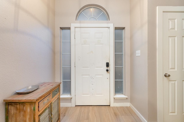 foyer with light hardwood / wood-style floors