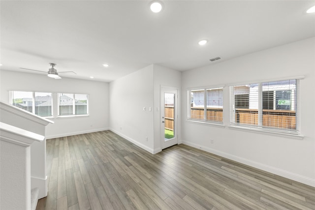 empty room featuring wood-type flooring and ceiling fan