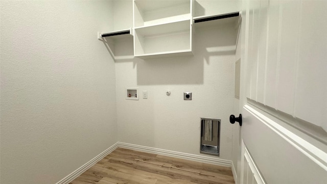 laundry room with hookup for an electric dryer, gas dryer hookup, hookup for a washing machine, and light hardwood / wood-style flooring