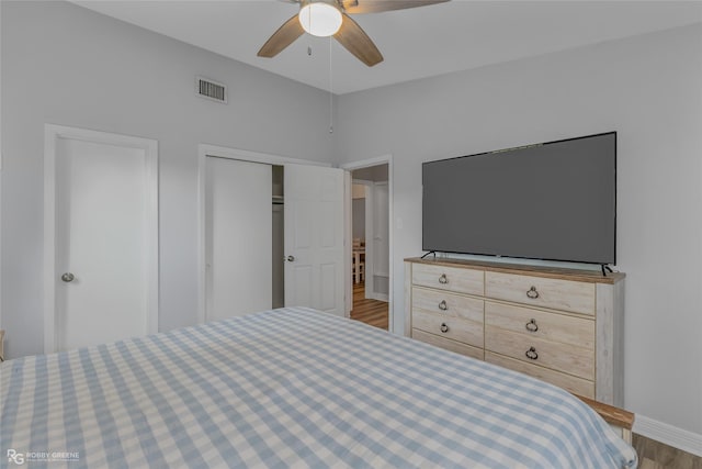 unfurnished bedroom with ceiling fan, a closet, and light hardwood / wood-style flooring