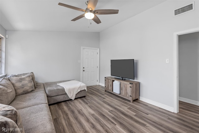 living room with vaulted ceiling, hardwood / wood-style floors, and ceiling fan