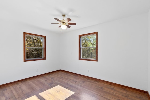 empty room featuring wood-type flooring and ceiling fan