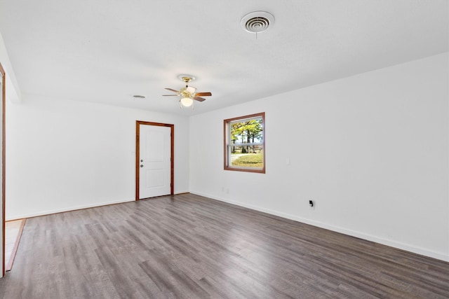 empty room with ceiling fan and wood-type flooring