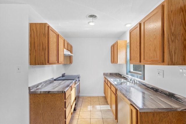 kitchen featuring sink, light tile patterned floors, and appliances with stainless steel finishes