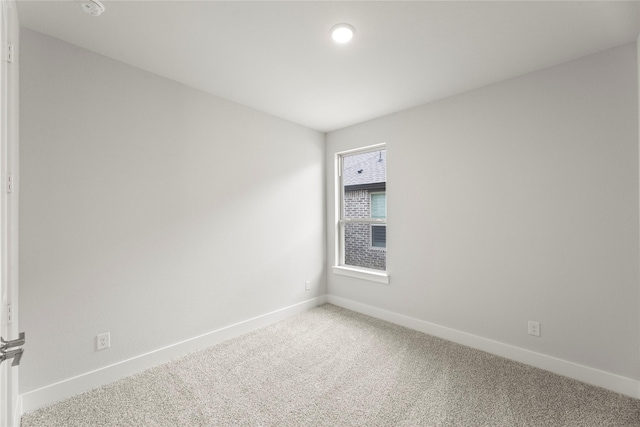7212 Dragonfly Ln, Little Elm, TX 76227 - spare room featuring carpet floors, baseboards, and a smoke detector