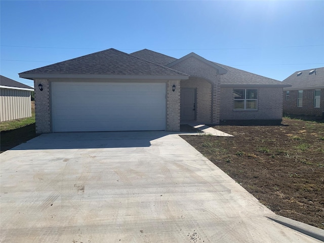 single story home featuring a garage