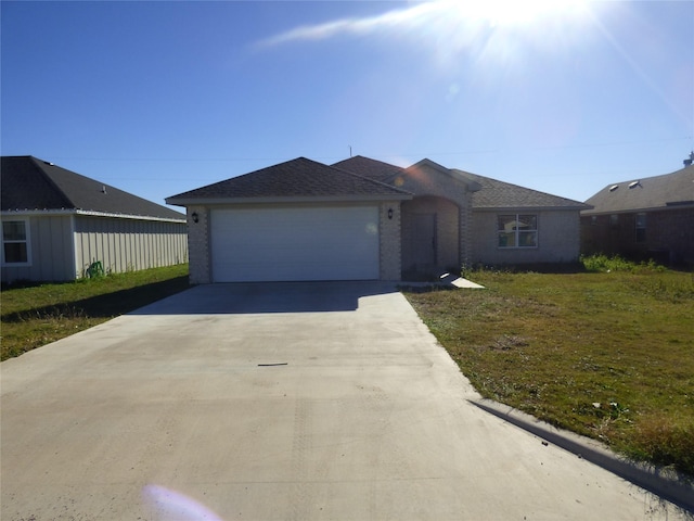 ranch-style house with a front lawn and a garage