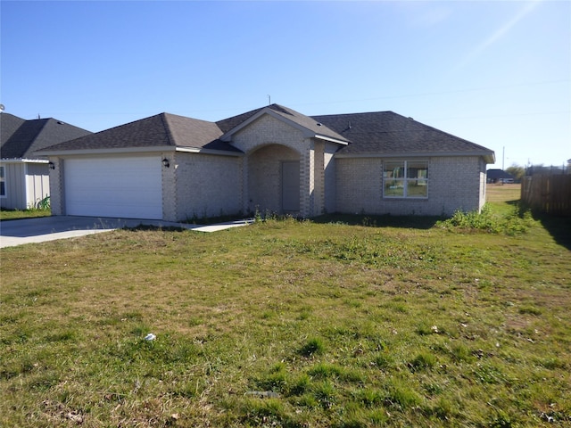 single story home featuring a front lawn and a garage