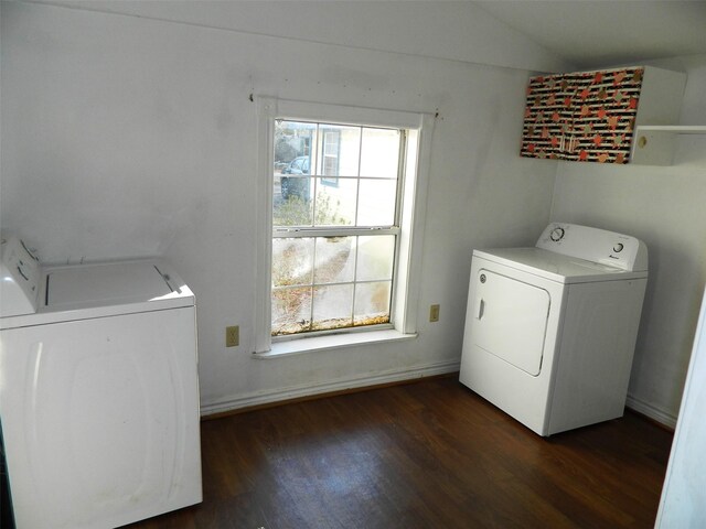 clothes washing area with dark hardwood / wood-style flooring and independent washer and dryer