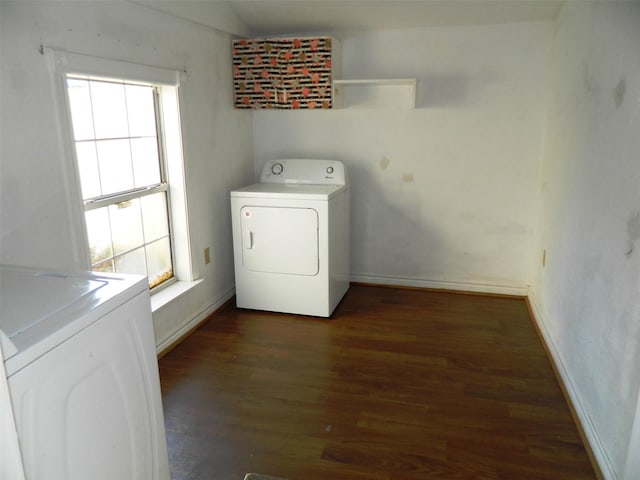 washroom featuring washer and clothes dryer and dark wood-type flooring