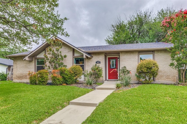 view of front of home with a front lawn