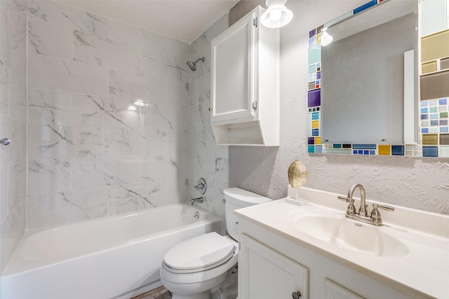 full bathroom featuring vanity, tiled shower / bath combo, and toilet