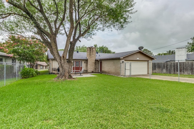 ranch-style home featuring a front yard and a garage