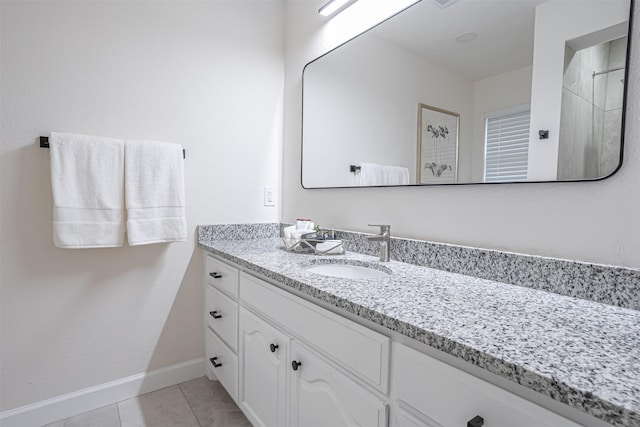 bathroom with tile patterned flooring and vanity