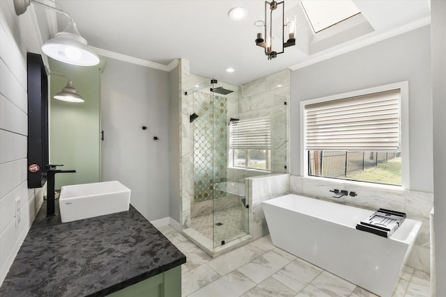 bathroom featuring plus walk in shower, vanity, ornamental molding, and a notable chandelier