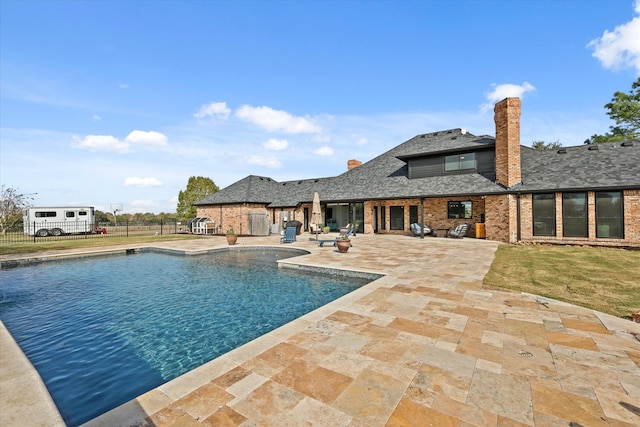 view of pool featuring a patio